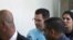 FILE - Ziv Orenstein (C), who is accused by U.S. authorities of engaging in a stock manipulation scheme involving U.S. penny stocks, arrives at a courtroom at the Jerusalem Magistrates Court July 22, 2015. 