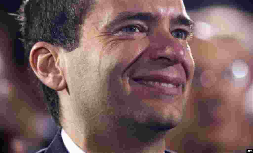 Tears roll down the face of an audience member during the signing ceremony for "don't ask, don't tell" repeal legislation that would allow gays to serve openly in the military, Wednesday, Dec. 22, 2010, at the Interior Department in Washington.