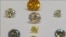 FILE - A still image from video shows coloured synthetic diamonds on display at De Beers' International Institute of Diamond Grading and Research in Maidenhead, Aug. 15, 2016. 