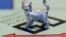 The newest Monopoly token, a cat, rests on the game board at Hasbro Inc. headquarters, in Pawtucket, R.I., Tuesday, Feb. 5, 2013.