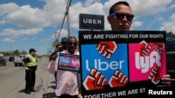 Uber and Lyft drivers protest during a day-long strike outside Uber’s office in Saugus, Massachusetts, U.S., May 8, 2019.