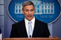 FILE - Acting director of U.S. Citizenship and Immigration Services Ken Cuccinelli speaks during a briefing at the White House in Washington, Aug. 12, 2019.