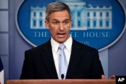 FILE - Acting director of U.S. Citizenship and Immigration Services Ken Cuccinelli speaks during a briefing at the White House in Washington, Aug. 12, 2019.