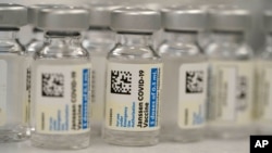 Vials of Johnson & Johnson COVID-19 vaccine sit in the pharmacy of National Jewish Hospital for distribution, March 6, 2021, in east Denver.