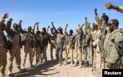 FILE - Puntland security forces celebrate in Balidhidin village, Puntland region, Somalia, on Jan. 26, 2025.