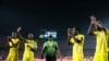 FILE - Zimbabwe players applaud their fans after the group A soccer match between Uganda and Zimbabwe at the Africa Cup of Nations at Cairo International Stadium in Cairo, Egypt on June 26, 2019.