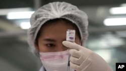 A health worker prepares a shot of the AstraZeneca COVID-19 vaccine for people at the Central Vaccination Center in Bangkok, Thailand, July 22, 2021. 