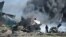 Firefighters attempt to extinguish the fire at Mogadishu's Aden Adde International Airport in Somalia after an Ethiopian Air Force aircraft crashed upon landing. (Photo provided by AMISOM)