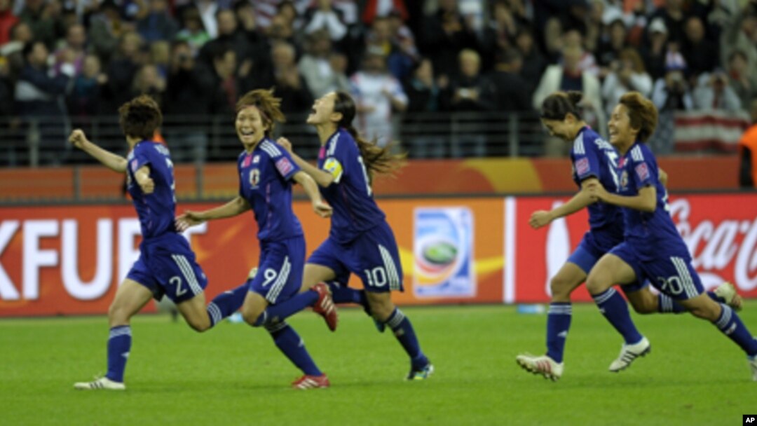 Japanese players celebrate after their team won the Women's World Cup of soccer.