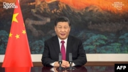 This video grab taken on Jan. 25, 2021, from the website of the World Economic Forum shows China's President Xi Jinping speaking from Pekin as he opens an all-virtual World Economic Forum, which usually takes place in Davos, Switzerland.