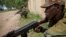 Somali National Army soldiers serving with the AU Mission in Somalia hold defensive positions in the town of Afgoye