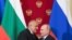 FILE - Russian President Vladimir Putin and Bulgarian Prime Minister Boyko Borissov hug after a joint news conference following their talks at the Kremlin in Moscow, Russia, May 30, 2018.