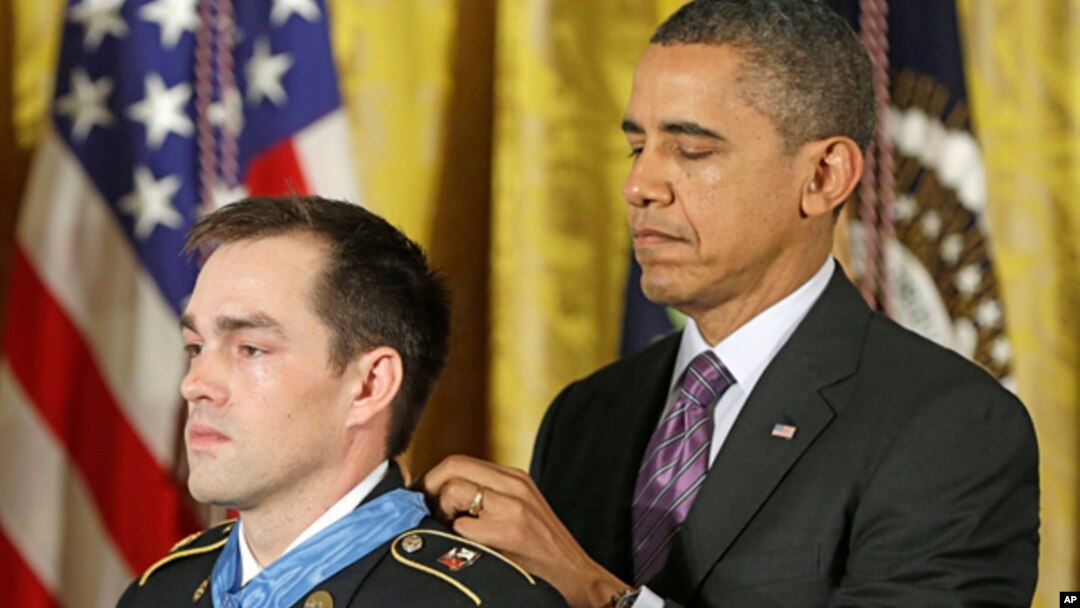 President Barack Obama bestows the Medal of Honor on retired Staff Sgt. Clinton Romesha for conspicuous gallantry, Feb. 11, 2013, in the East Room of the White House. Romesha will be a guest at the State of The Union Address.