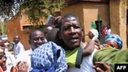 FILE - Niger journalist Moussa Kaka (C) is surrounded by supporters in Niamey, Oct. 7, 2008, after an appeals court ordered his provisional release just over a year since his detention for allegedly undermining state security. 