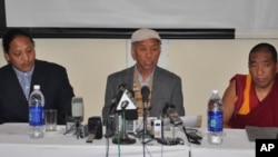 Chief Election Commissioner Jampel Choesang (C) flanked by two additional election commissioners
 announces election results of the 15th Tibetan Parliament-in-Exile and 3rd Kalon Tripa at a
conference in Dharamsala, on 12 November 2010/Photo by Jigme Tser