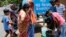 Indians collect drinking water from a mobile water tanker on a hot summer day in Prayagraj, India, Saturday, June 15, 2019. Many parts of India are experiencing extreme heat conditions. 