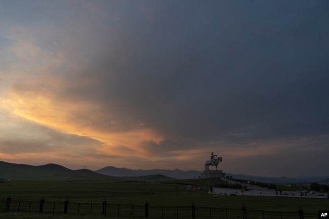 A 40-meter-tall stainless steel statue of Genghis Khan, a national hero who amassed power to become the leader of the Mongols in the early 13th century is seen on the outskirts of Ulaanbaatar, Mongolia on July 1, 2024. (AP Photo/Ng Han Guan)