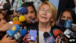 Venezuela's attorney general Luisa Ortega speaks to journalists outside the Supreme Court of Justice headquarters building in Caracas, June 13, 2017. 