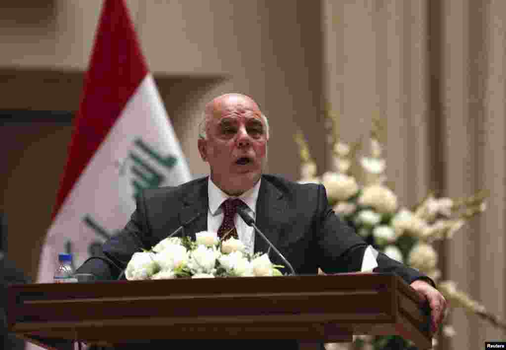 Iraq&#39;s incoming Prime Minister Haider al-Abadi speaks to Iraqi lawmakers before submitting his government selections, in Baghdad, Sept. 8, 2014.