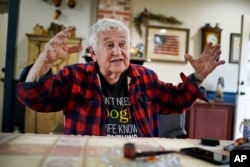 FILE - Peter Doak speaks to a reporter at his home, Wednesday, April 26, 2023, in Columbia Falls, Maine. Doak, an Army veteran, supports a plan to build the world's tallest flagpole on undeveloped land just outside of town. (AP Photo/Robert F. Bukaty)