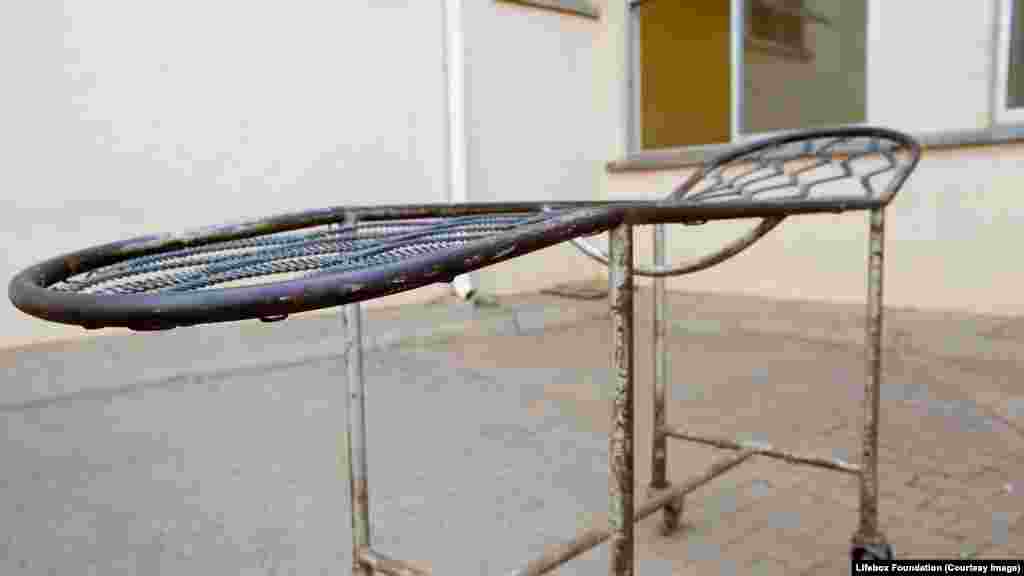 Old hospital bed outside operating theater block in hospital.