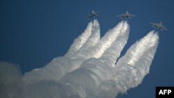 The Indian Air Force (IAF) Sukhoi Su-30 fighter jets perform during the inaugural day of the 15th edition of &#39;Aero India 2025&#39;, a military aviation exhibition, at the Yelahanka Air Force Station in Bengaluru.