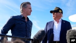 U.S. President Donald Trump talks with California Governor Gavin Newsom after arriving on Air Force One at Los Angeles International Airport in Los Angeles, Jan. 24, 2025.