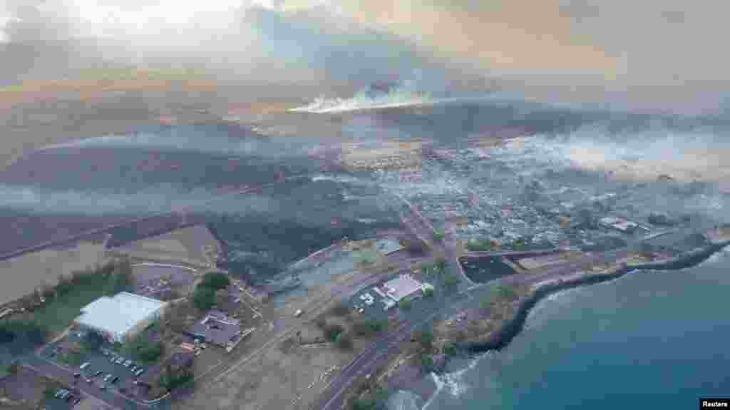 An aerial view as smoke rises from burnt areas amidst wildfires in Maui, Hawaii, U.S., August 9, 2023, in this screenshot taken from a social media video. (Vince Carter/via Reuters)