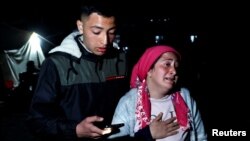 People react after a quake in Antakya in Hatay province, Turkey