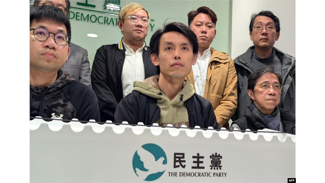 Lo Kin-hei, center, chairman of Hong Kong's Democratic Party, along with other senior leaders, attends a press conference at the party's headquarters in Hong Kong on Feb. 20, 2025.