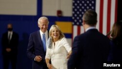 Democratic presidential candidate and former Vice President Joe Biden, his wife, Jill Biden, vice presidential candidate Senator Kamala Harris and her husband Douglas Emhoff are see in Wilmington, Delaware, Aug. 12, 2020.