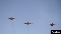 FILE - Russian Sukhoi Su-25 fighter jets are seen in flight.