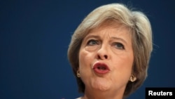 British Prime Minister Theresa May speaks on the final day of the annual Conservative Party Conference in Birmingham, England, Oct. 5, 2016. 