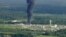 Smoke rises from a chemical plant in Crosby, near Houston, Texas, Sept. 1, 2017. Thick black smoke and towering orange flames shot up Friday from the flooded Houston-area chemical plant after two trailers of highly unstable compounds blew up a day earlier