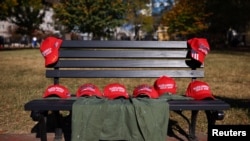 MAGA hats are laid out on a bench outside of the White House, after Republican Donald Trump won the U.S. presidential election, in Washington, D.C., Nov. 6, 2024. 