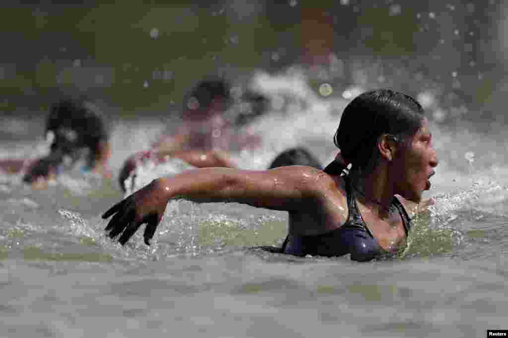 An indigenous woman competes in a swimming competition during the first World Games for Indigenous Peoples in Palmas, Brazil.