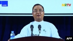 FILE - This screengrab provided via AFPTV and taken from a broadcast by Myanmar Radio and Television (MRTV) in Myanmar on April 9, 2021, shows junta spokesman Brigadier General Zaw Min Tun speaking during a live press conference.