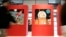  Visitors pass by drawings by Belgium illustrator Herge during a Tintin exhibition in Paris, Dec.19, 2006.  The country enters the space race, as illustrated in the comic strip in the 1950s, with plans to form a space agency next year.