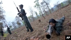 FILE - Maoist rebels or Naxalites, officially the Communist Party of India (Maoist), that takes its name from the Naxalbari, a village outside Kolkata where the revolt began in 1967.