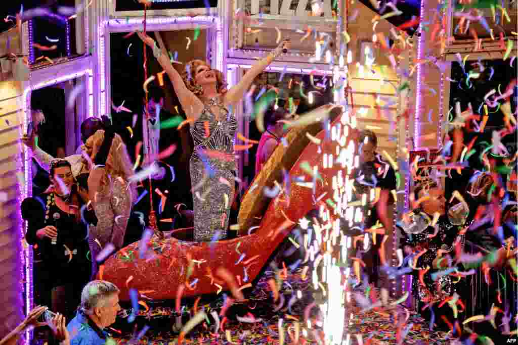 This handout image released by the Florida Keys News Bureau shows female impersonator Christopher Peterson, the star of the New Year&#39;s Eve &quot;Red Shoe Drop,&quot; celebrating the beginning of the new year on Jan. 1, 2024, in Key West, Fla.