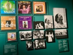 Oum Kalthoum photos and covers of albums that sold in the millions at the Arab World Institute's Divas exhibit. (Lisa Bryant/VOA)
