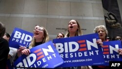 Supporters of Democratic presidential hopeful former Vice President Joe Biden cheers as he speaks at the National Constitution Center in Philadelphia, on March 10, 2020. 