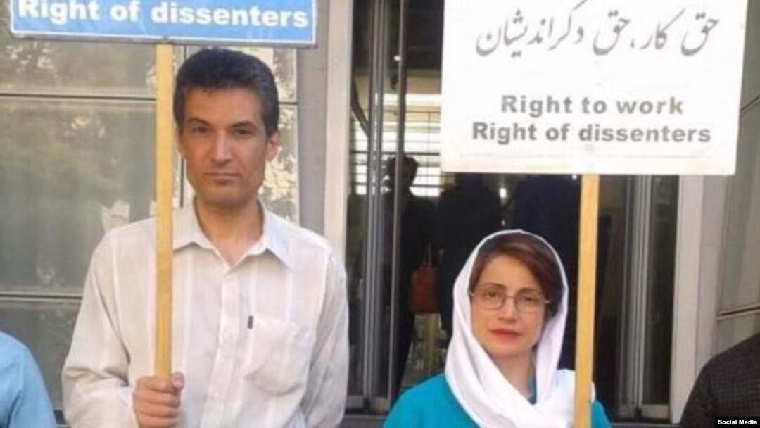 In this undated photo shared on social media, Iranian rights activist and physician Farhad Meysami attends a protest alongside his friend and human rights lawyer, Nasrin Sotoudeh. Another activist reported that Meysami, who was arrested, July 31, 2018, will expand a hunger strike to include giving up water beginning Sept. 8, 2018. 