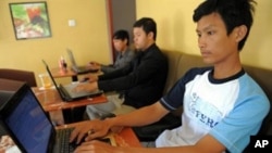 Cambodian men are using internet at a coffee shop in Phnom Penh, file photo. 