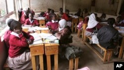 FILE - Pupils at the Toi Primary School in Nairobi, Kenya sit in a classroom and study without a teacher, because the teachers are on strike. Members of the Kenya National Union of Teachers and the Kenya Union of Post Primary Education Teachers went on strike for several weeks earlier this year after the government refused to increase salaries.