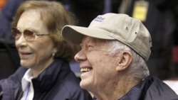 Former President Jimmy Carter and wife Rosalynn Carter get ready to lead Habitat for Humanity volunteers in Washington earlier this month