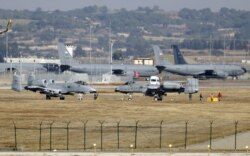 FILE - U.S. Air Force A-10 Thunderbolt II fighter jets (foreground) are pictured at Incirlik Air Base, near Adana, Turkey, Dec. 11, 2015.