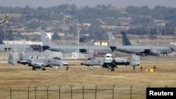 FILE - U.S. Air Force A-10 Thunderbolt II fighter jets (foreground) are pictured at Incirlik Air Base, near Adana, Turkey, Dec. 11, 2015.