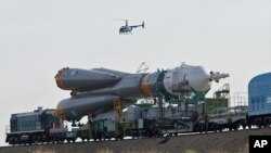 Russian Soyuz TMA-02M space ship that will carry new crew to the International Space Station, ISS, is transported from hangar to the launch pad at the Russian leased Baikonur cosmodrome, Kazakhstan (File Photo - June 5, 2011)