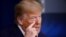 President Donald Trump gestures as he talks about the first coronavirus test he had, during a coronavirus task force briefing at the White House, April 18, 2020, in Washington.
